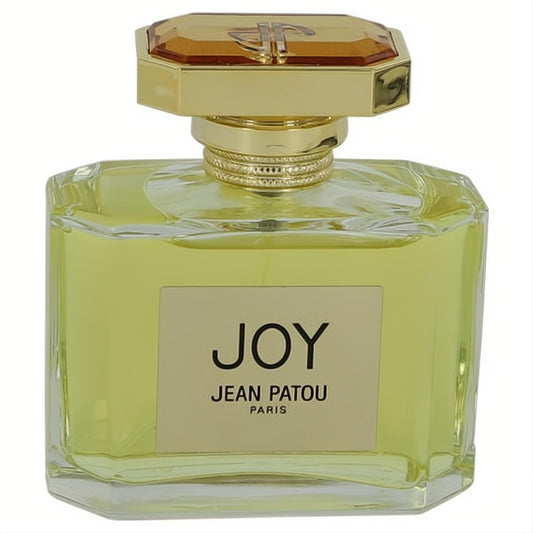 Joy by Jean Patou Eau De Parfum. Elegant clear glass bottle, pale yellow liquid, luxurious gold and amber faceted cap.