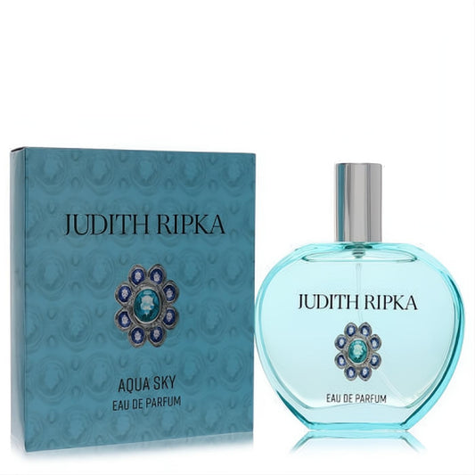 Elegant Judith Ripka Aqua Sky Eau De Parfum. Stunning light blue bottle, silver cap, and sparkling jeweled emblem with matching aqua box.