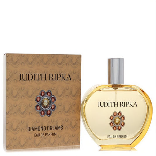 Elegant Judith Ripka Diamond Dreams Eau De Parfum. Gold box and clear amber bottle with sparkling jewel emblem, silver cap.