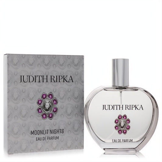 Judith Ripka Moonlit Nights 3.4 oz Eau de Parfum. Elegant clear glass bottle with silver cap and stunning purple jewel, next to its gray box.