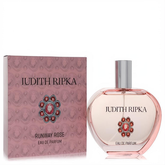 Judith Ripka Runway Rose 3.4 oz EDP. Pink glass bottle with ornate silver and rose jeweled emblem, beside matching textured box.