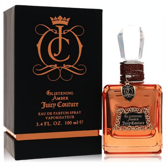 Luxurious Juicy Couture Glistening Amber 3.4 oz EDP spray. Amber glass bottle, clear faceted cap, braided neck, and ornate black/gold box.