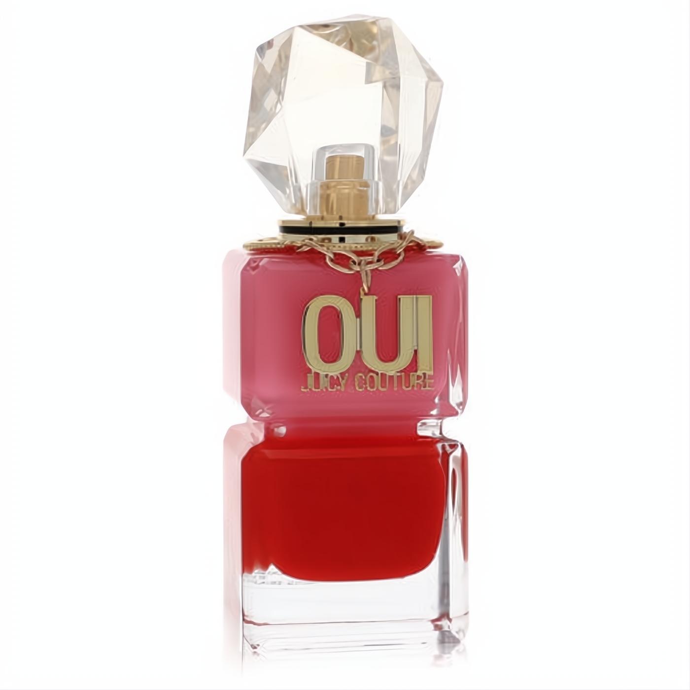 Iconic Juicy Couture Oui perfume spray. Two-toned pink and red bottle with bold gold 'OUI' text and a sparkling crystal cap.