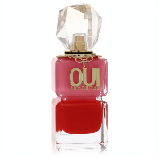 Iconic Juicy Couture Oui perfume spray. Two-toned pink and red bottle with bold gold 'OUI' text and a sparkling crystal cap.