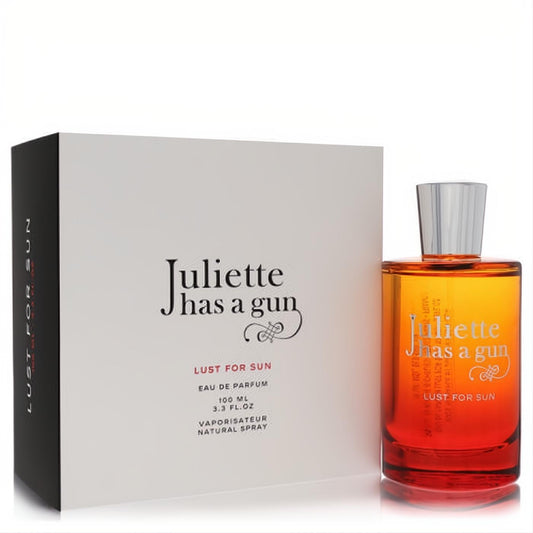Juliette Has A Gun Lust For Sun 3.3 oz EDP spray in a vibrant ombre orange-red glass bottle with a sleek silver cap, beside its elegant white box.