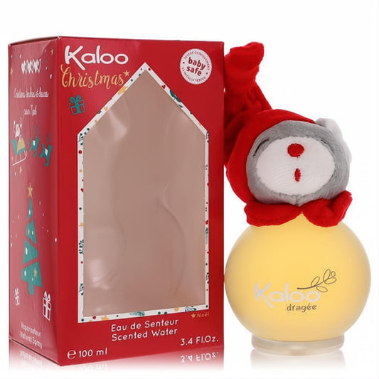 Festive Kaloo Christmas 3.4 oz Eau De Senteur in a frosted yellow bottle with a plush teddy bear stopper, beside a red holiday gift box.