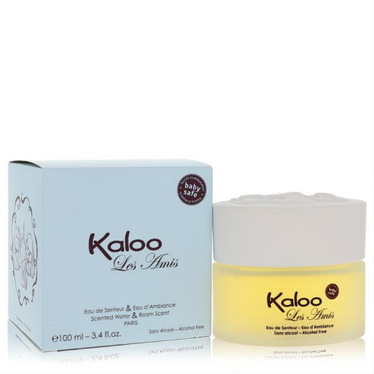 Kaloo Les Amis 3.4 oz baby-safe fragrance in a frosted yellow glass jar with a sculpted white lid, next to its elegant pale blue box.