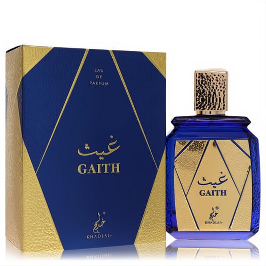Khadlaj Gaith unisex EDP. Stunning deep blue bottle with textured gold cap, beside its elegant blue and gold geometric box.