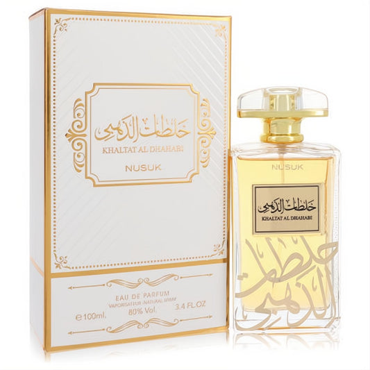 Stunning Nusuk Khaltat Al Dhahabi unisex Eau De Parfum, 3.4 oz. Luxurious gold-accented bottle with amber liquid and ornate white box.