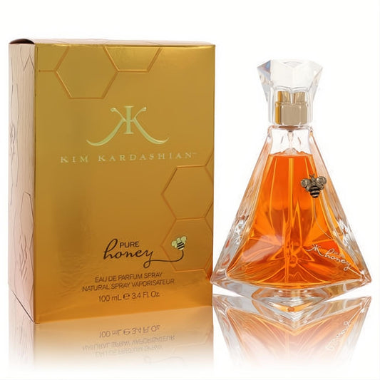 Luxurious Kim Kardashian Pure Honey 3.4 oz EDP. Faceted clear bottle with amber liquid, bee charm, and a shimmering gold honeycomb box.