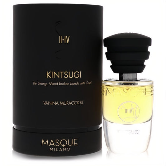 Elegant Kintsugi by Masque Milano 1.18 oz EDP spray. Clear bottle, golden liquid, black ribbed cap, and luxurious black & gold box.