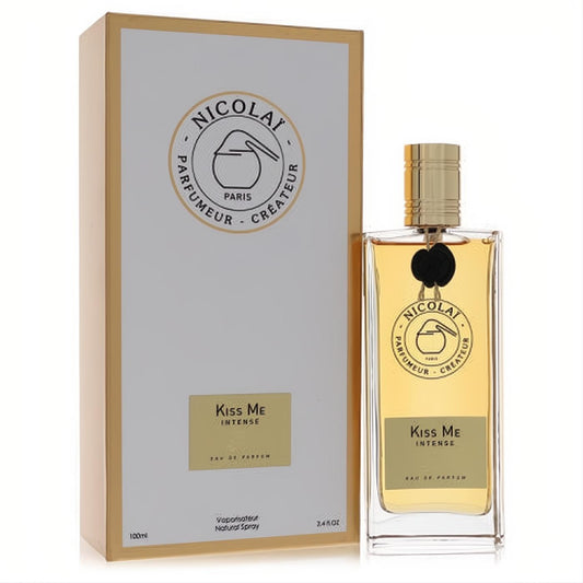Kiss Me Intense Nicolai 3.4 oz women's EDP. Elegant clear glass bottle with amber liquid, gold cap, and matching gold-trimmed box.