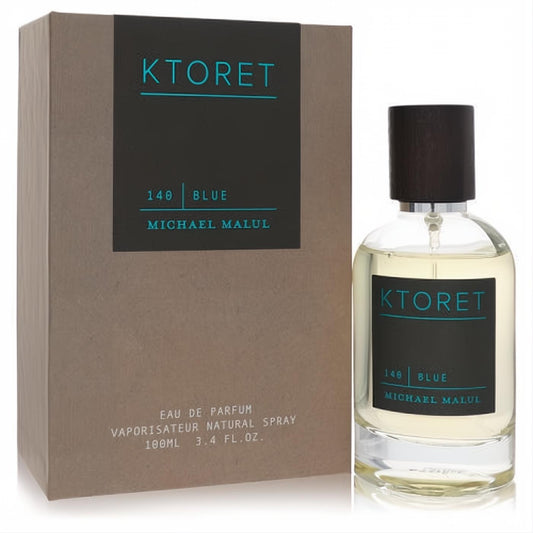 Experience Ktoret 140 Blue 3.4 oz EDP. Clear glass bottle, dark wood cap, black/teal label, and stylish kraft brown box.