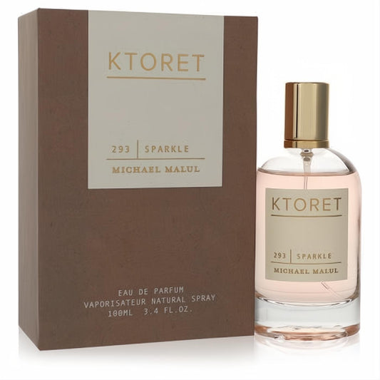 Ktoret 293 Sparkle 3.4 oz EDP. Elegant clear bottle with blush pink fragrance, gold cap, and chic brown box.