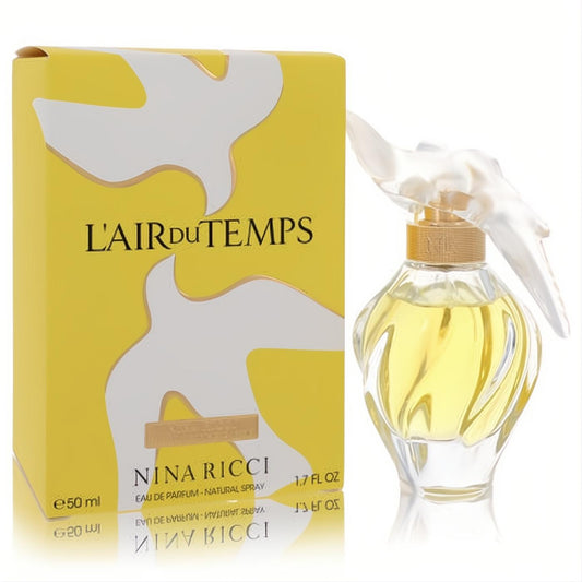 Nina Ricci L'Air Du Temps 1.7 oz Eau De Parfum spray. Elegant curved glass bottle with iconic white bird cap and vibrant yellow box.