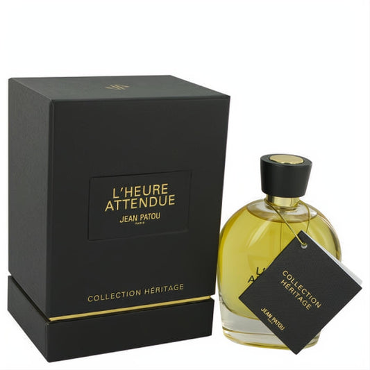Luxurious L'Heure Attendue Jean Patou 3.3 oz EDP spray. Golden liquid in a clear glass bottle with black cap, elegant black & gold box.