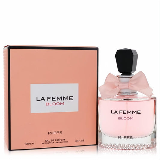 Elegant La Femme Bloom Riiffs 3.4 oz EDP spray. Pink liquid, delicate bow, faceted black cap, and sparkling crystal base.