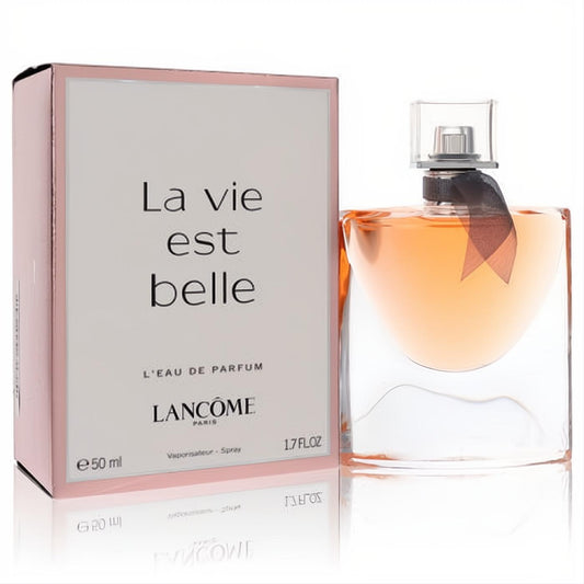 Lancome La Vie Est Belle 1.7 oz EDP. Elegant curved glass bottle with warm amber fragrance, black ribbon, and signature pink box.