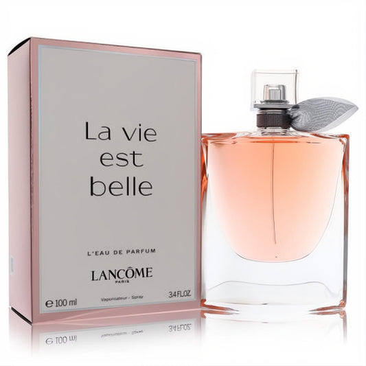 Experience Lancome La Vie Est Belle 3.4 oz EDP. Iconic glass bottle with peachy-pink fragrance, elegant ribbon, and chic rose gold box.