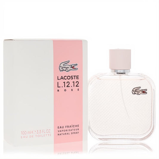 Lacoste L.12.12 Rose Eau Fraiche 3.3 oz EDT. Elegant ribbed glass bottle with pink cap & crocodile logo, beside its white & pink box.
