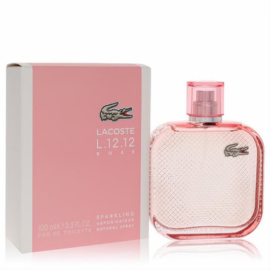 Chic Lacoste L.12.12 Rose Sparkling 3.3 oz EDT. Features a stylish pink bottle with textured glass and iconic crocodile logo, alongside its matching box.
