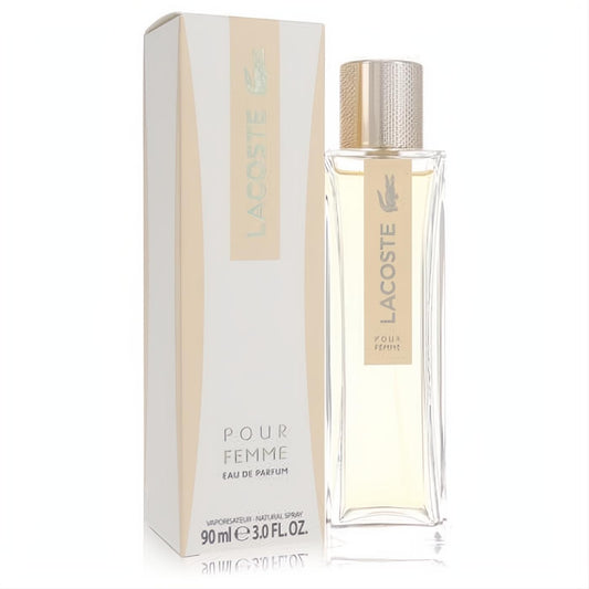Luxurious Lacoste Pour Femme 3 oz Eau De Parfum spray. Clear rectangular bottle with gold cap and elegant white box.
