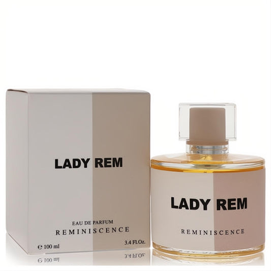 Luxurious Lady Rem Reminiscence 3.4 oz Eau De Parfum. Elegant white & beige bottle, golden liquid, clear cap.