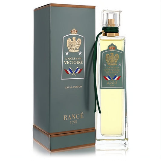 Regal Rance L'Aigle de la Victoire 3.4 oz Eau de Parfum. Golden liquid in a clear bottle with an eagle crest, green label, and matching box.