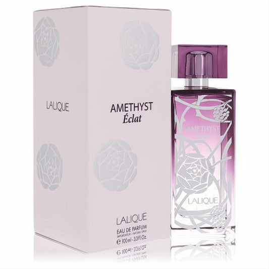 Elegant Lalique Amethyst Eclat 3.4 oz EDP spray. Vibrant purple glass bottle with intricate silver floral and berry design, matching box.