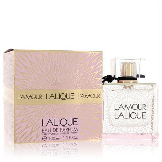 Sensuous Lalique L'amour 3.3 oz Eau De Parfum: elegant clear square bottle with gold cap, black ribbon, and a romantic pink gold floral box.