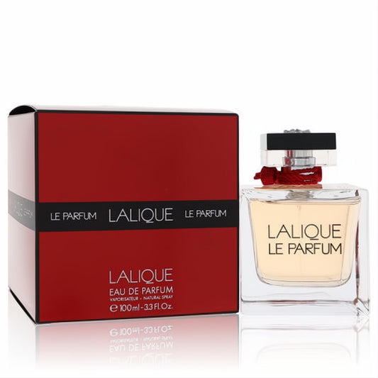 Lalique Le Parfum 3.3 oz EDP spray: elegant clear glass bottle with amber liquid, red ribbon, and matching red box.