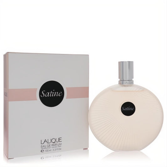 Luxurious Lalique Satine Eau De Parfum 3.3 oz. Frosted beige round bottle with radiating lines, silver cap, and elegant white & pink box.