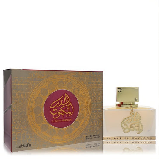 Stunning Lattafa Al Dur Al Maknoon Gold unisex perfume. Features a sleek gold bottle with calligraphy charm and an ornate gold and maroon box.