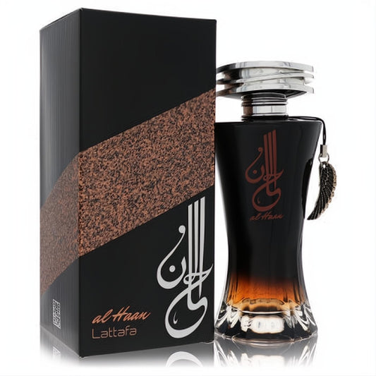 Luxurious Lattafa Al Haan unisex perfume. Black-to-amber glass bottle, silver cap, elegant wing charm, and textured black box.