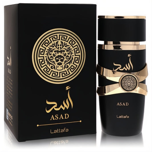Lattafa Asad unisex Eau De Parfum. Luxurious 3.4 oz black bottle with bold gold accents, lion emblem, and matching elegant box.