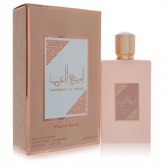 Discover Lattafa Asdaaf Ameerat Al Arab Prive Rose 3.4 oz EDP. Elegant matte pink bottle, ornate gold cap, and shimmering rose box.