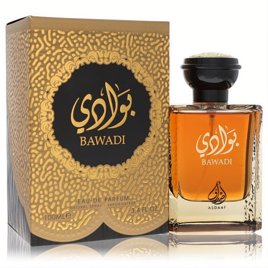 Lattafa Asdaaf Bawadi 3.4 oz EDP. Luxurious amber bottle with black and gold cap, displayed with its ornate gold and black patterned box.