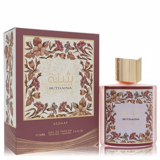 Beautiful Lattafa Asdaaf Buthaina 3.4 oz unisex EDP. Rose gold bottle, elegant gold cap, and intricate floral design.