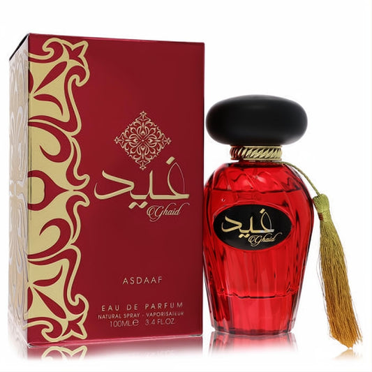 Elegant Lattafa Asdaaf Ghaid unisex Eau De Parfum. Deep red faceted bottle, gold tassel, and ornate matching box, 3.4 oz.