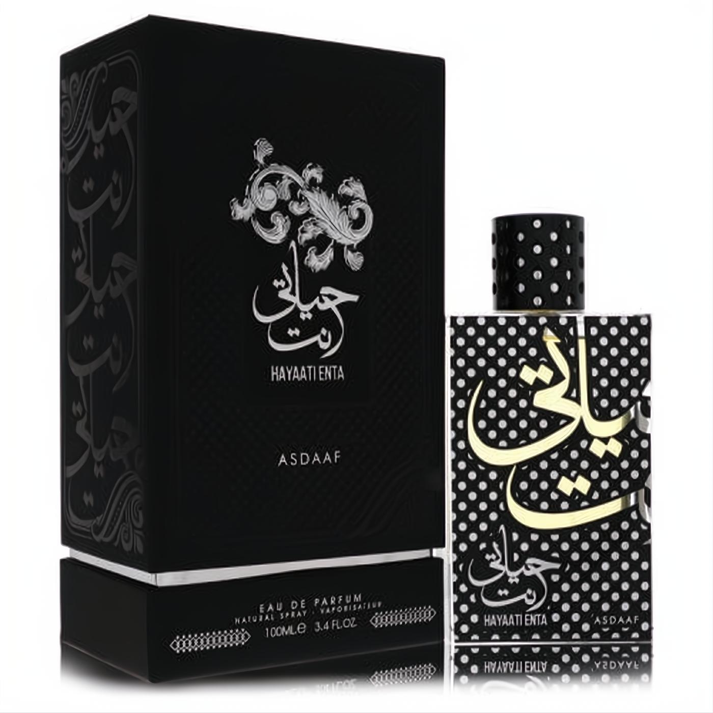 Exquisite Lattafa Asdaaf Hayaati Enta 3.4 oz unisex EDP. Features a matte black box and a striking polka dot bottle with gold Arabic script.