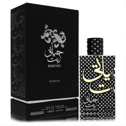 Exquisite Lattafa Asdaaf Hayaati Enta 3.4 oz unisex EDP. Features a matte black box and a striking polka dot bottle with gold Arabic script.