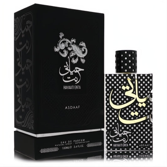 Exquisite Lattafa Asdaaf Hayaati Enta 3.4 oz unisex EDP. Features a matte black box and a striking polka dot bottle with gold Arabic script.