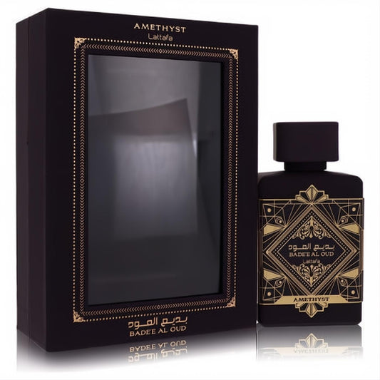 Lattafa Badee Al Oud Amethyst 3.4 oz unisex EDP. Dark purple bottle with intricate gold designs and matching luxury box.