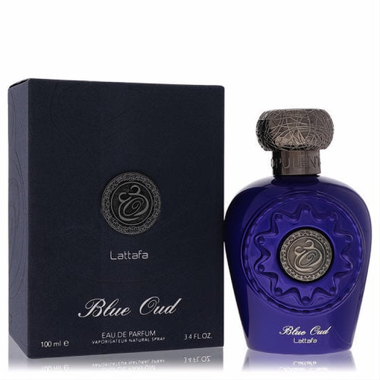 Lattafa Blue Oud unisex EDP, 3.4 oz. Luxurious deep blue bottle with intricate metallic cap and emblem, beside its elegant matching box.
