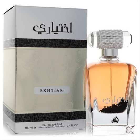 Lattafa Ekhtiari unisex EDP 3.4 oz. Elegant silver box, clear glass bottle with amber fragrance and textured cap.