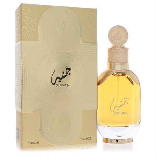 Exquisite Lattafa Guinea 3.4 oz unisex EDP in a radiant gold bottle with a unique coin cap, next to its matching textured gold box.