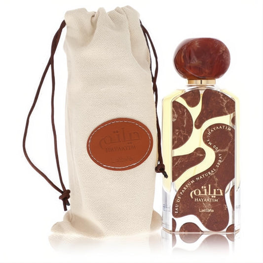Lattafa Hayaatim 3.4 oz unisex EDP. Striking brown & cream abstract bottle, polished cap, and luxurious canvas drawstring pouch.