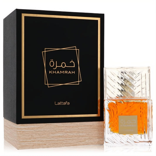Lattafa Khamrah unisex 3.4 oz Eau De Parfum. Clear bottle, amber liquid, elegant black and gold box.