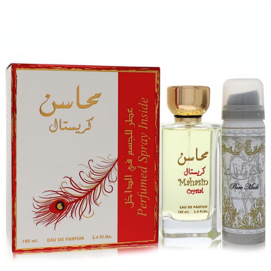 Lattafa Mahasin Crystal 3.4 oz EDP in clear bottle with gold cap, 1.7 oz Pure Musk deodorant, and ornate red & gold gift box.