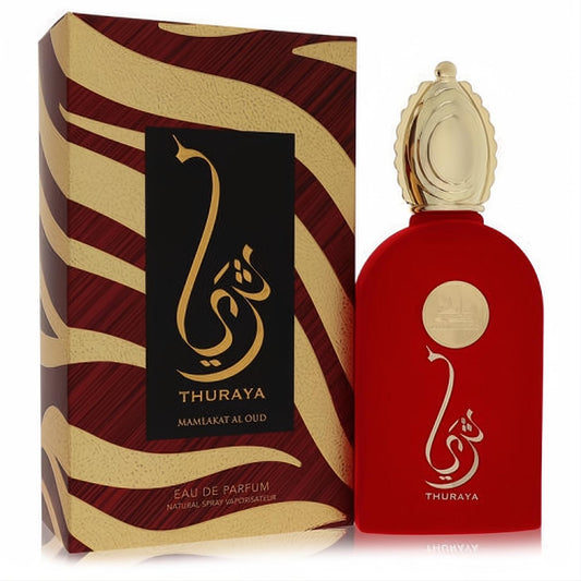 Luxurious Lattafa Mamlakat Al Oud Thuraya 3.4 oz unisex EDP in a red velvet-finish bottle with ornate gold cap and Arabic script, alongside its striking gold and brown striped box.
